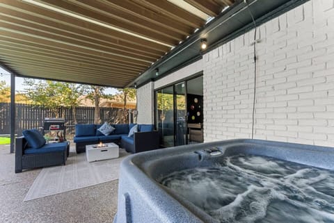 Indulge in ultimate relaxation in our hot tub, surrounded by inviting outdoor seating. This serene oasis is perfect for unwinding under the stars, whether you're soaking away the day’s stress or enjoying good company. 
