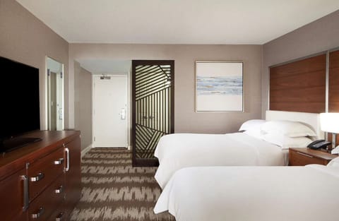 Settle in easily with a spacious layout and restful bedding.