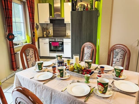 Furniture, Interior Design, Tableware, Table, Chair, Kitchen & Dining Room Table, Dining Room, Lighting, Room, Serveware