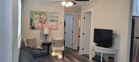 Living room is open to kitchen and dining areas