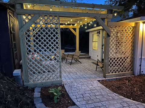Main entry through pergola. 