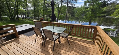 Host elegant outdoor meals with breathtaking water views from your private, expansive wooden deck.