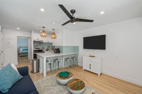 Open-concept living space with the kitchen just beside the cozy living room, creating a seamless flow for both cooking and relaxation.