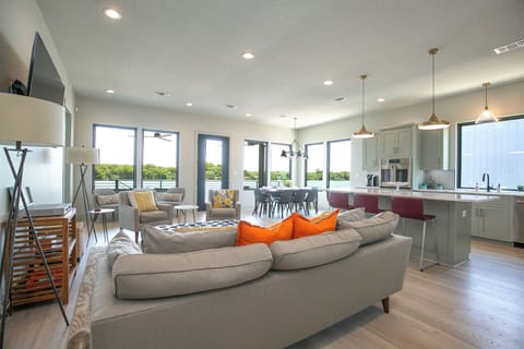 Open concept of kitchen overlooking family room