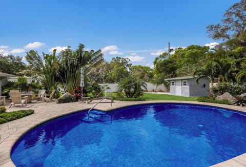 Easy entry into the pool and visiting poolside with guests lounging in the sun.
