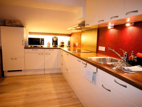 Kitchen, Countertop, Kitchen Appliance, Flooring, Interior Design, Major Appliance, Wood, Cabinetry, Floor, Plumbing Fixture