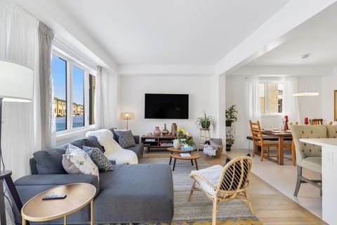 A cozy, comfortable relaxing living room, TV, books, games, sofa, open space.