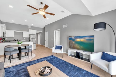 Bright living room with open layout and large windows - Single-level layout with no interior stairs