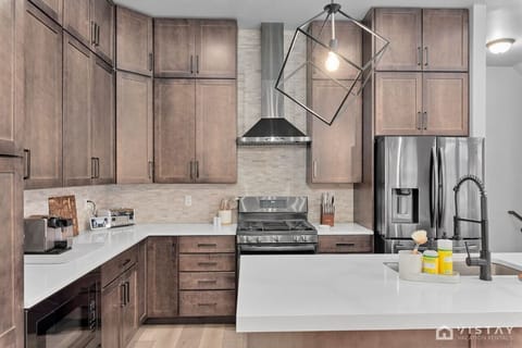 Fully equipped kitchen featuring brand-new appliances, ready to meet all your cooking needs and make meal preparation a breeze.