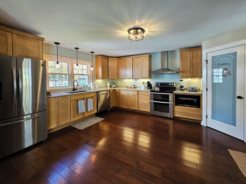 The spacious, full kitchen has everything you need to prep a meal or grab a snac