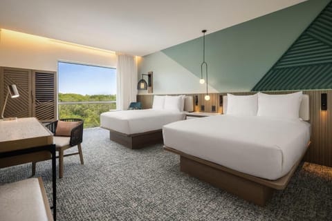 Wake up refreshed in crisp beds with calming treetop views.