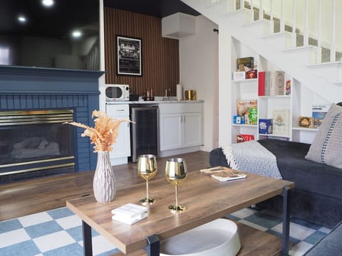 Lower level bar setup with seating and modern flair.