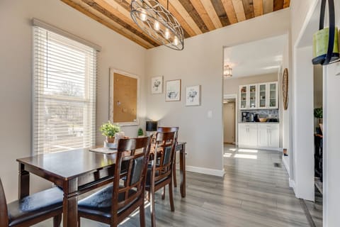 Sunlit dining room adjacent to both the modern kitchen and liviing room.