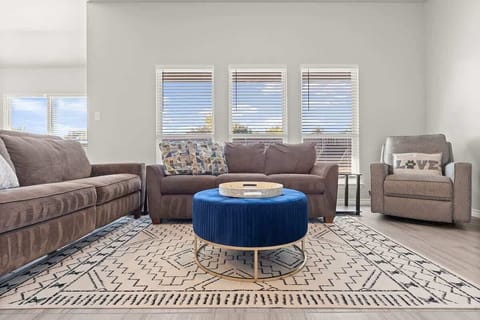 Living Room: Bright and inviting space with plush seating, chic decor, and sunshine-filled views!