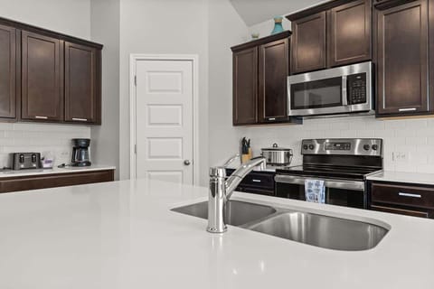 Coffee maker, toaster, Crock pot, kitchen knives, microwave, oven all that you need to cook and prep food for the family