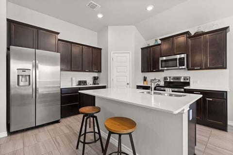 Kitchen Retreat: Whip up culinary delights in this sleek space with modern appliances and stylish decor!