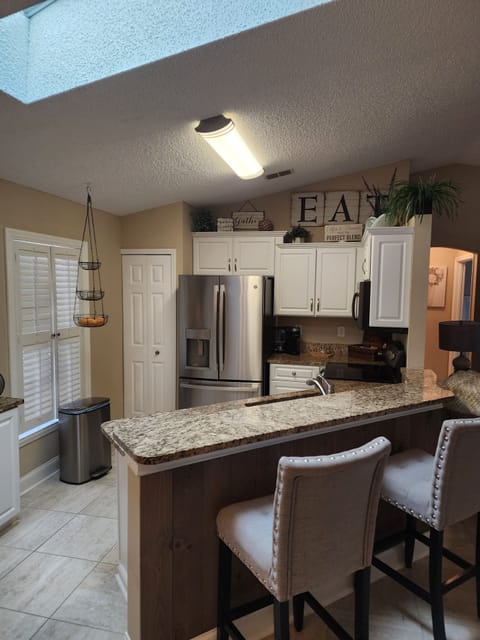 Open concept kitchen overlooking the salt water pool 