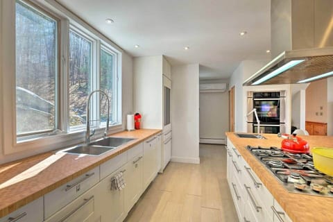 Fully stocked kitchen with all cooking utensils, pots, pans, and gadgets. 6 burner stovetop, main sink, prep sink, double wall oven, two full size fridge and freezer, microwave, toaster oven, toaster, drip and whole bean coffee maker. We got it all.