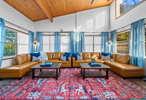 Whether you’re curling up with a good book or chatting with friends, the warm tones and lake-inspired decor make it feel like a true retreat.