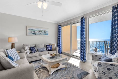 Nautical vibes in the decor in this living room with a beach view