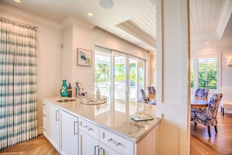 The living room Wet bar has all of your bar supplies, a mini fridge, and a sink. Cabinets are stocked with cocktail and wine glasses.