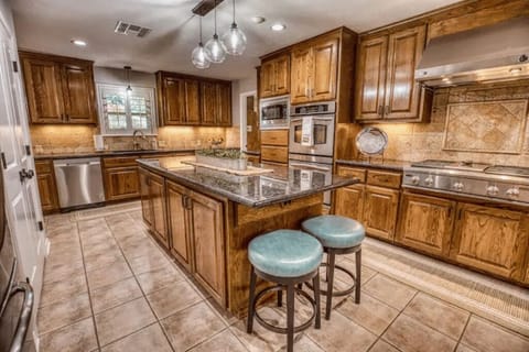 Gourmet eat-in kitchen with gas range and dual ovens. 