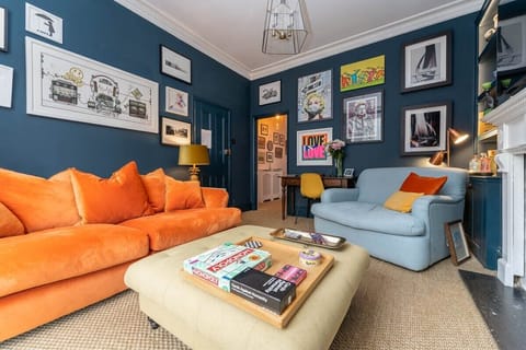 Bright and bold living room with beautiful, high ceilings - great for entertaining.