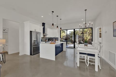 Kitchen and dining area with access to the back deck