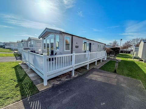 Unwind with your loved ones on a last-minute family holiday at Hopton Holiday Village, complete with a static caravan and decking.