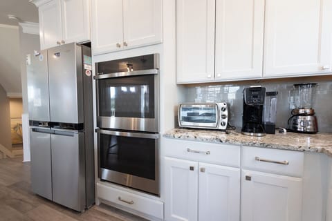 stainless steel with dual ovens to prepare memorable meals