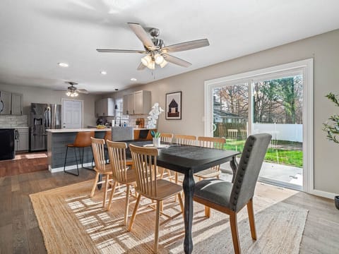 The perfect spot for a delicious meal, surrounded by loved ones. The warm colors and natural light create a comforting ambiance.