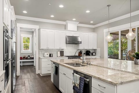 Chef! This is for you! The kitchen is spacious with a large countertop, perfect for preparing meals during your stay!