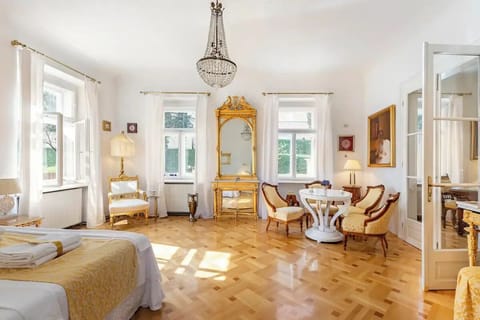 This is a cozy bedroom  with its view on the historical stone gate