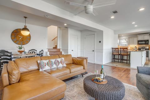 Bright and airy living area filled with natural light and lakefront charm.