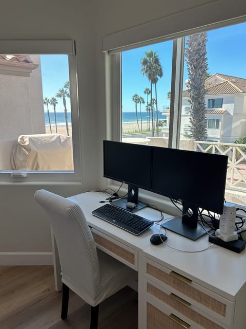 Second bedroom with view and work from home desk with monitors