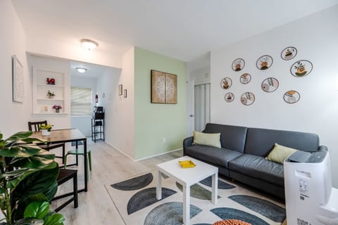 Living room featuring a comfortable futon and plenty natural light.