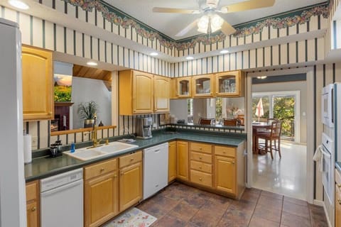 Enjoy ample kitchen space in the main level kitchen, perfect for making delicious meals for your large gathering.