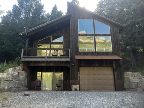 Our place with reflection of Castle Rock off windows