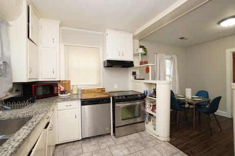 The full kitchen is equipped with all the basic appliances you need, making it easy to prepare meals and enjoy the comforts of home during your stay.