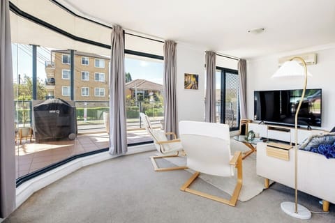 After a day at the beach, unwind on the sofa with some TV or a book in the inviting, open-plan living area. 