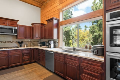 Brand-new Chef's kitchen, 6 burner stove, double oven, convection microwave. 
