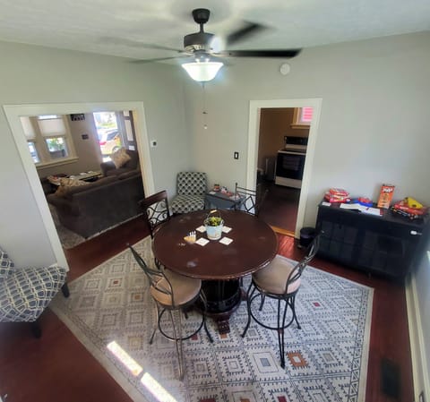 High-Top Table & Chairs, Games, Hardwood Floors, Rug and Room-Darkening Blinds