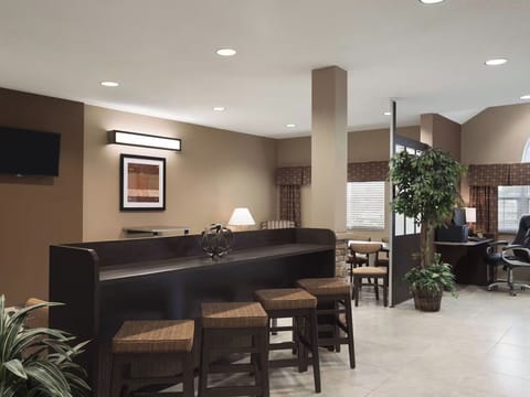 Gather comfortably in the cozy lounge with warm lighting.
