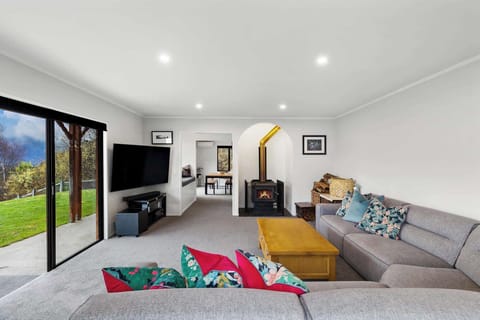 Living Room: Enjoy stunning views and a warm fireplace in this stylish, inviting space!