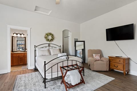 Queen bed with a large new smart TV great for streaming your favorite show!