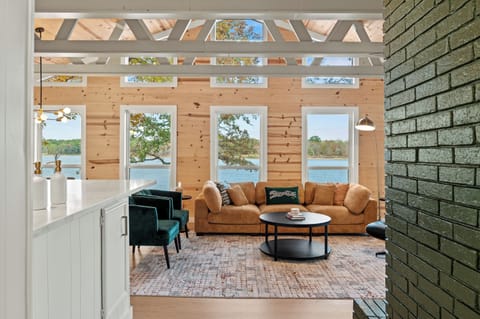 Spacious great room with endless panoramic lake views. 
