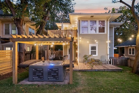 6 Person Hot tub surrounded by string lights, 2nd floor balcony and swing chairs is the perfect place to relax!