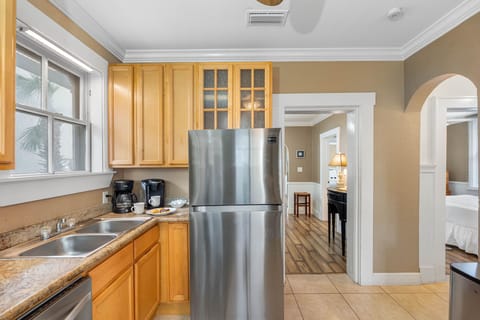 The kitchen boasts generous counter space, providing plenty of room for meal preparation, whether you’re whipping up a quick breakfast or creating a gourmet dinner.