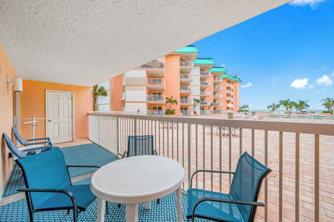 Spacious balcony with view of the pool and gulf