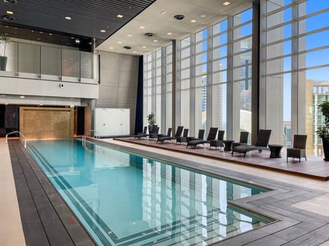 Indoor Pool Oasis: Dive into relaxation with stunning views and serene lounge spaces!